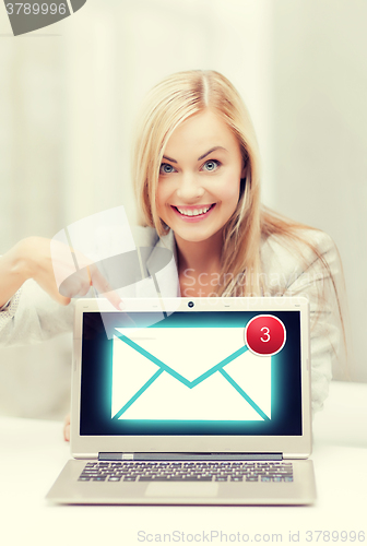 Image of businesswoman with laptop computer