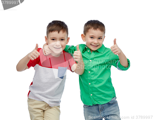 Image of happy smiling little boys showing thumbs up