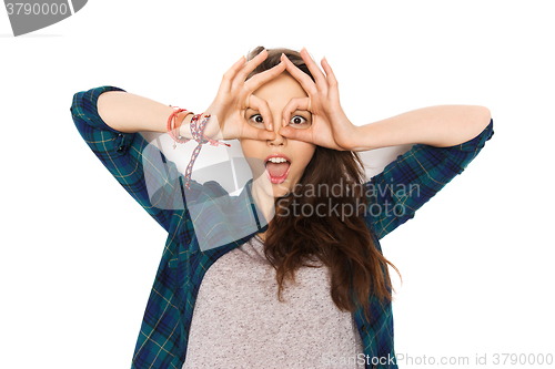 Image of happy teenage girl making face and having fun