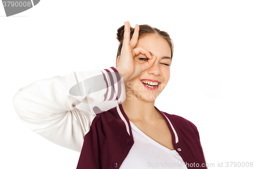 Image of happy teenage girl making face and having fun