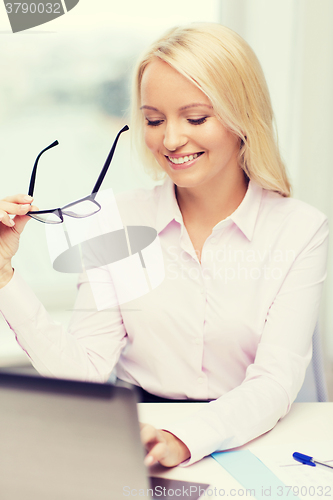 Image of smiling businesswoman or student with laptop