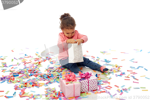 Image of happy little baby girl with birthday presents