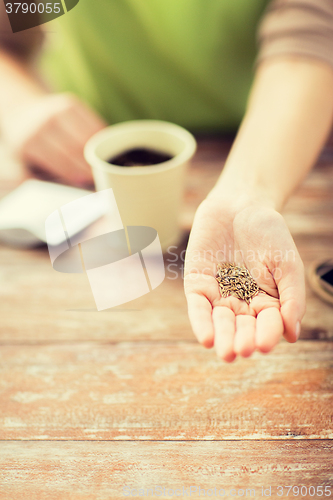 Image of close up of woman hand holding seeds