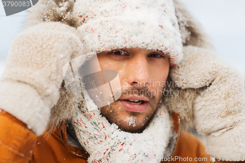 Image of face of man in winter clothes outdoors