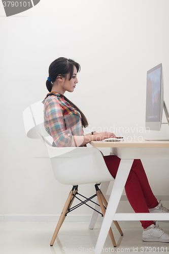 Image of startup business, woman  working on desktop computer