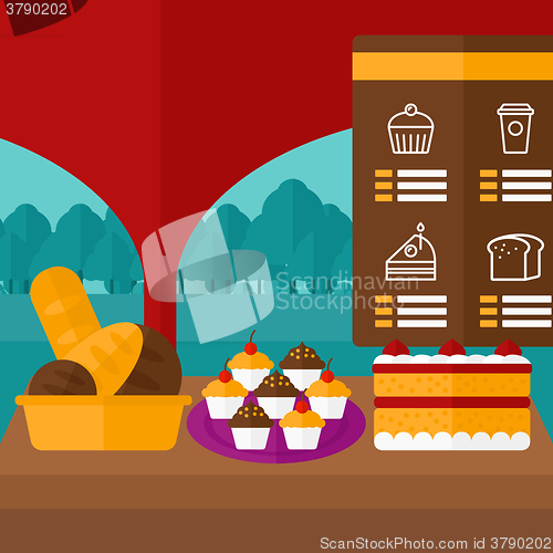 Image of Background of bakery with table full of bread and pastries.