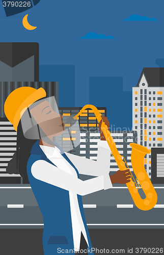 Image of Woman playing saxophone.