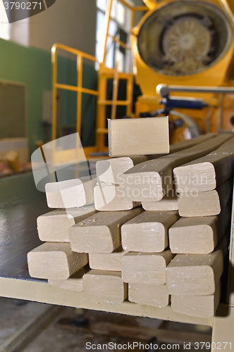 Image of Pieces of soap on a conveyor belt
