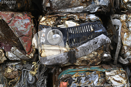 Image of A pile of compressed cars in blocks for processing