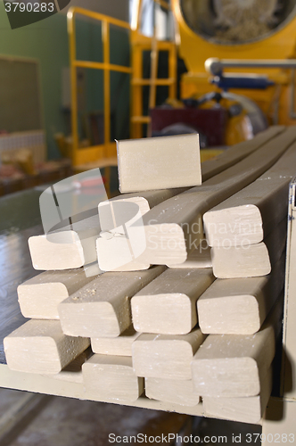 Image of Pieces of soap on a conveyor belt
