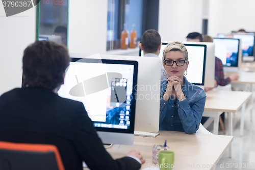 Image of startup business, woman  working on desktop computer