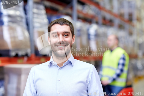 Image of businessman over warehouse loader on forklift 