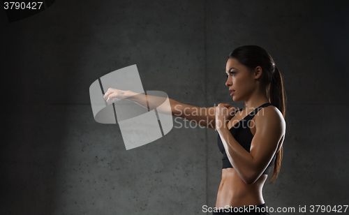 Image of woman boxing in gym