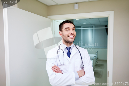 Image of smiling doctor with stethoscope at hospital 