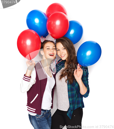 Image of happy teenage girls with helium balloons