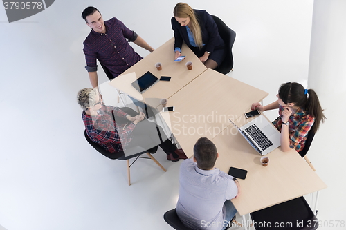 Image of aerial view of business people group on meeting