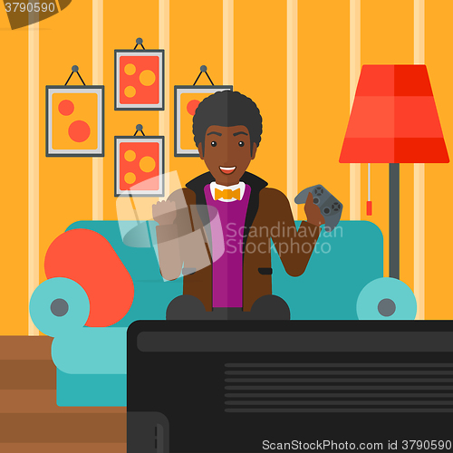 Image of Man playing video game.
