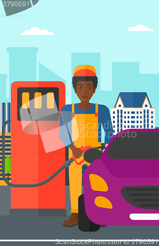 Image of Man filling up fuel into car.