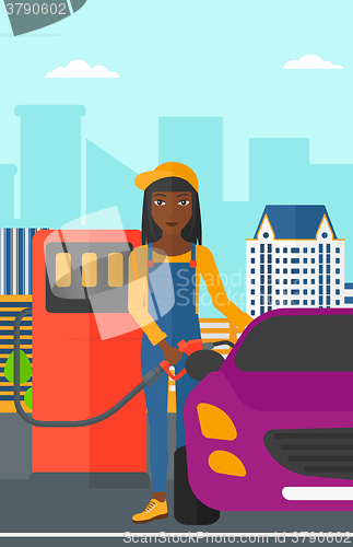 Image of Woman filling up fuel into car.