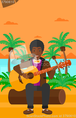 Image of Man playing guitar.