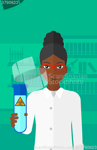 Image of Laboratory assistant with test tube.
