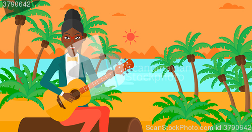 Image of Woman playing guitar.