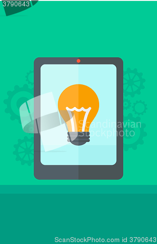 Image of Background of digital tablet with lightbulb.