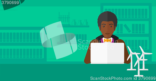 Image of Man working at laptop. 