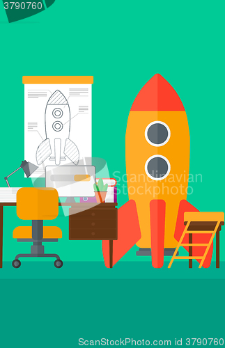 Image of Background of workspace with business start-up rocket.