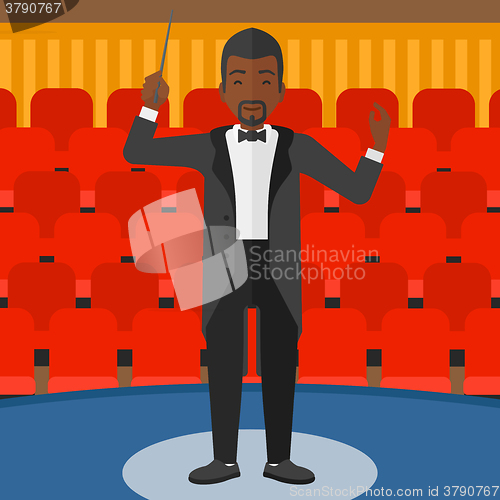 Image of Conductor directing with baton.