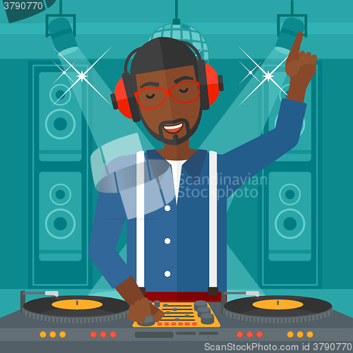 Image of Smiling DJ with console.