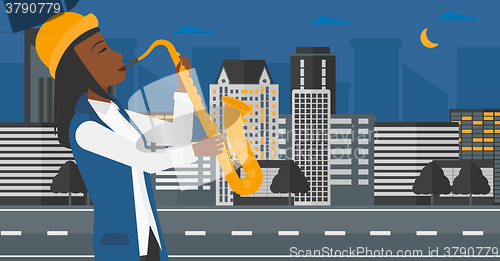 Image of Woman playing saxophone.