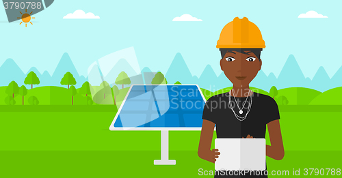 Image of Woman holding tablet computer.