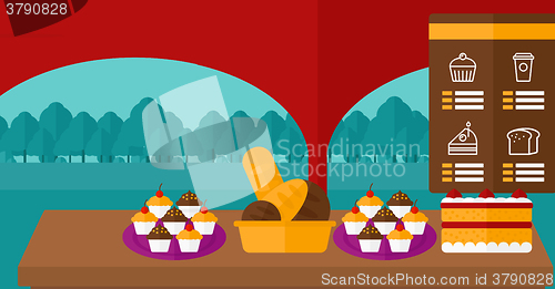 Image of Background of bakery with table full of bread and pastries.