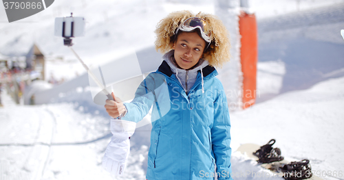 Image of Smiling young woman posing for a photograph