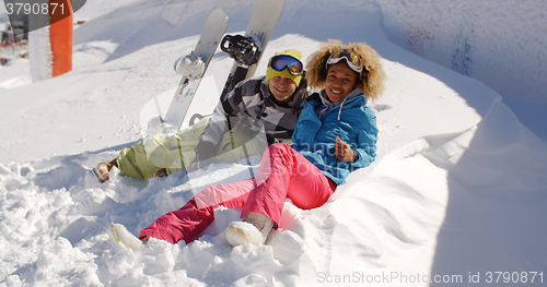 Image of Young couple enjoying their winter vacation