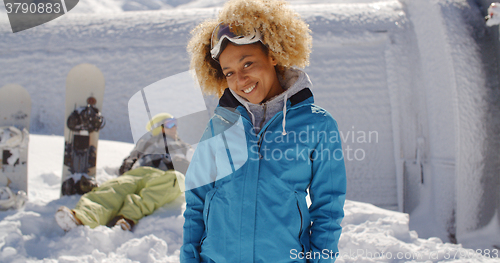 Image of Cute skier front of friend in snow