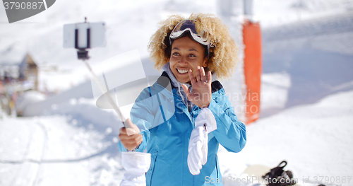 Image of Smiling young woman posing for a photograph