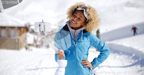 Image of Smiling young woman posing for a photograph