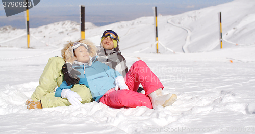 Image of Affectionate young couple enjoying the fresh snow