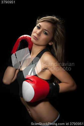 Image of Sexy young blond woman with red boxing gloves