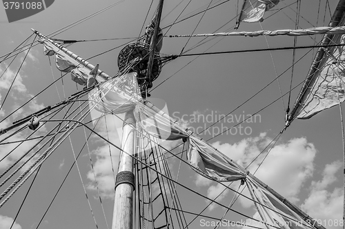 Image of Mast with sails of an old sailing vessel, black and white photo