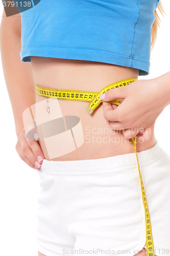 Image of Fitness model with measuring tape 