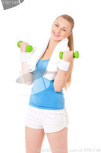 Image of Woman in fitness wear exercising with dumbbells