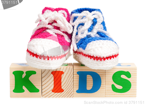 Image of Wood alphabet blocks with booties for baby