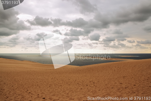 Image of Dune of Pilat, view over the ocean and cloudy sky