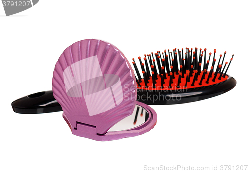 Image of Mirror and small hairbrush