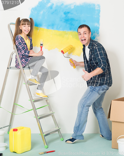 Image of Father and daughter makes repairs at home