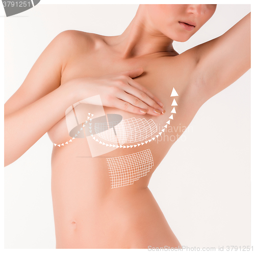 Image of Boobs correction with help of plastic surgery on white background