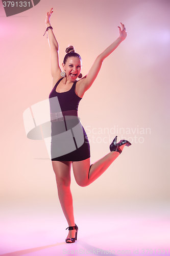 Image of The young cool woman is dancing